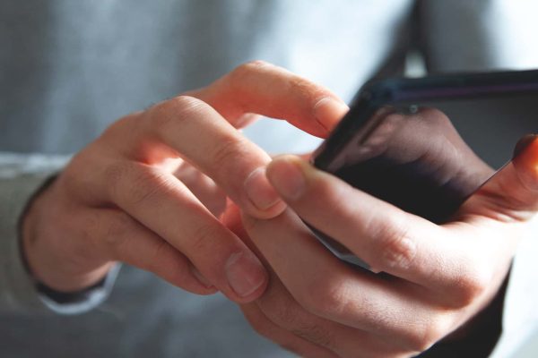 A Person Using A Mobile Phone